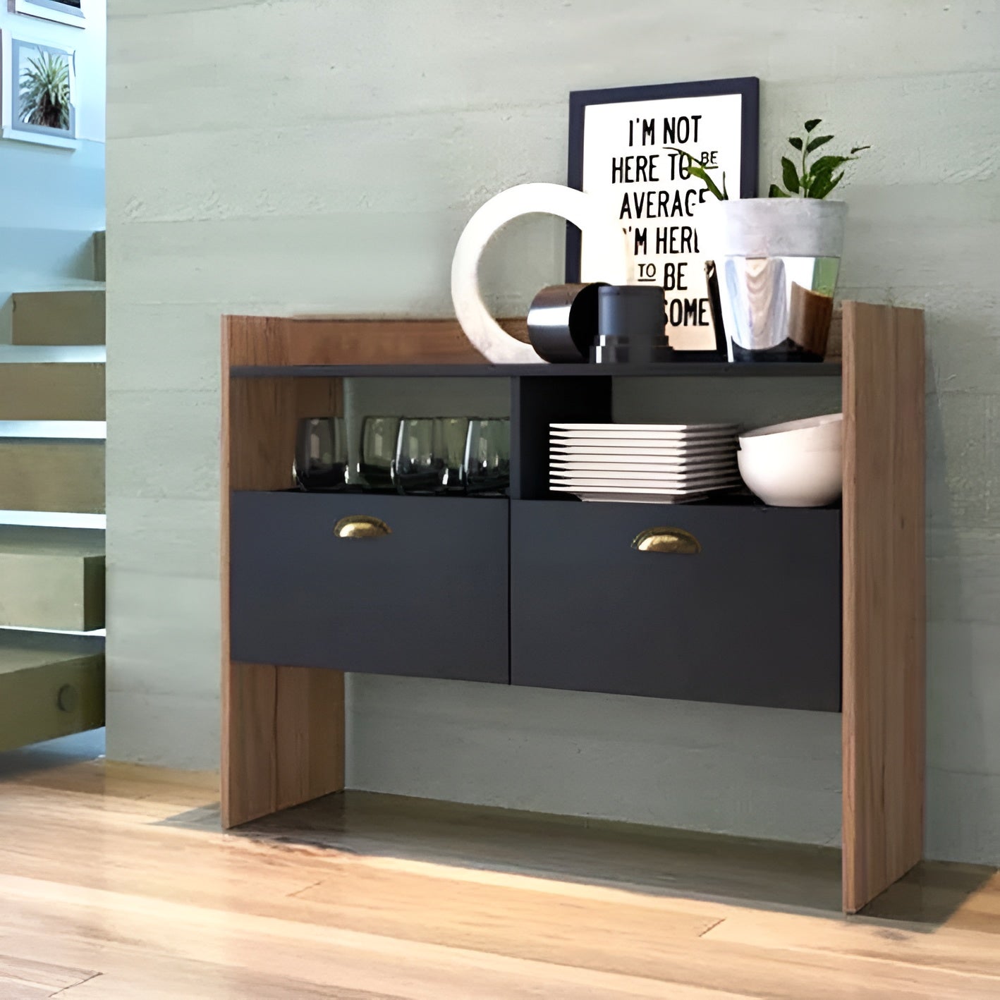 Modern kitchen cabinet with wooden accents and black lower section, featuring decorative items.