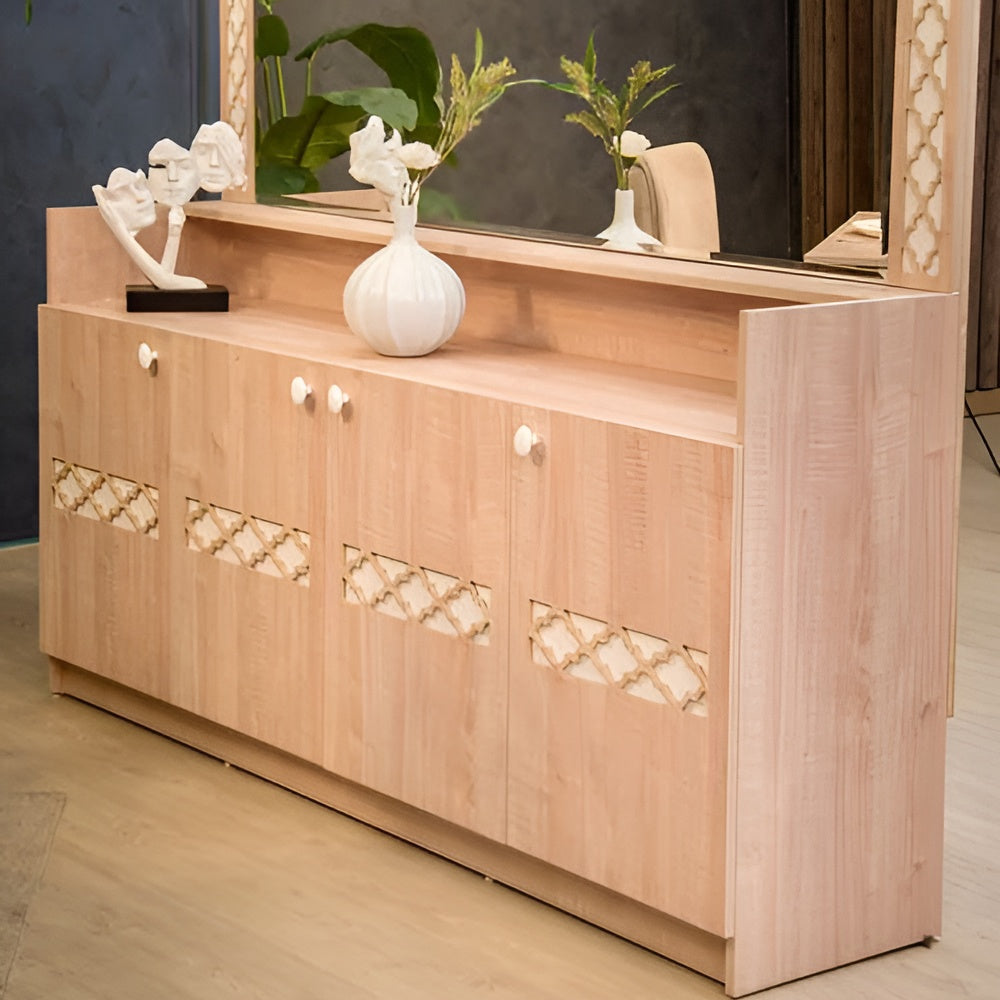 Wooden sideboard with decorative mirror and decor items in a room setting.
