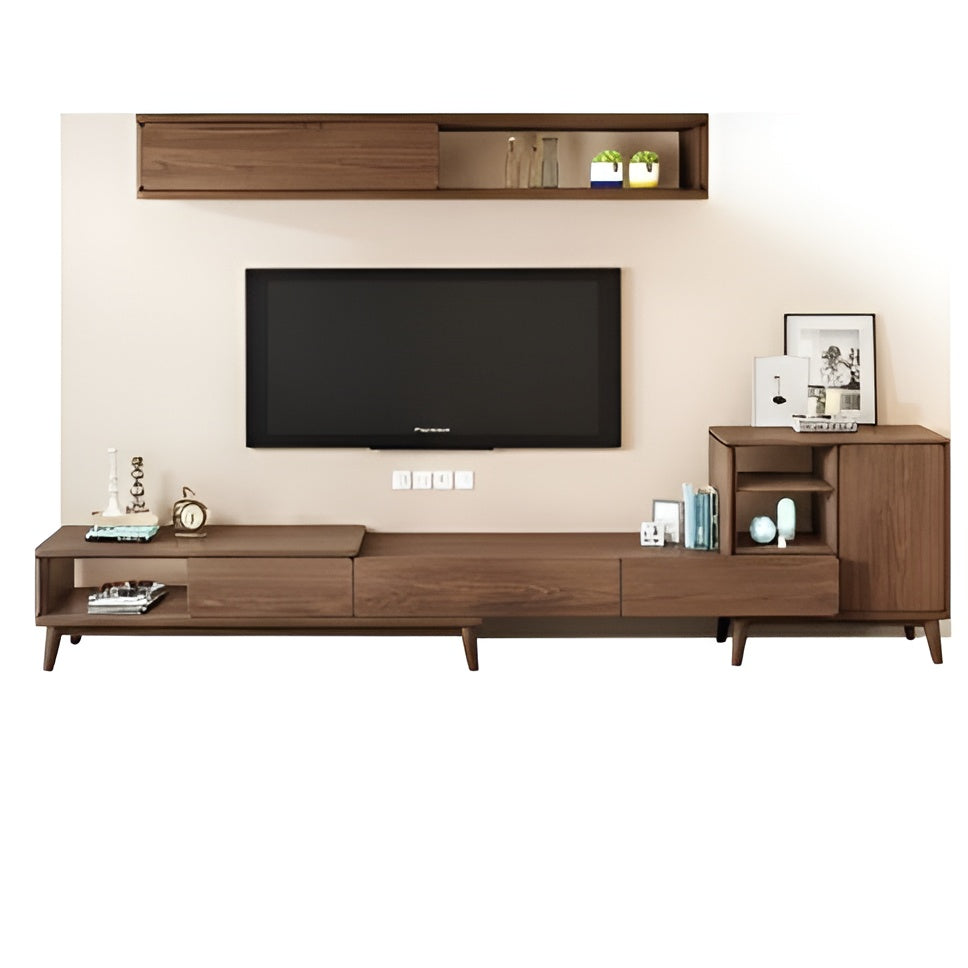 Wooden TV stand with a television mounted on a beige wall.