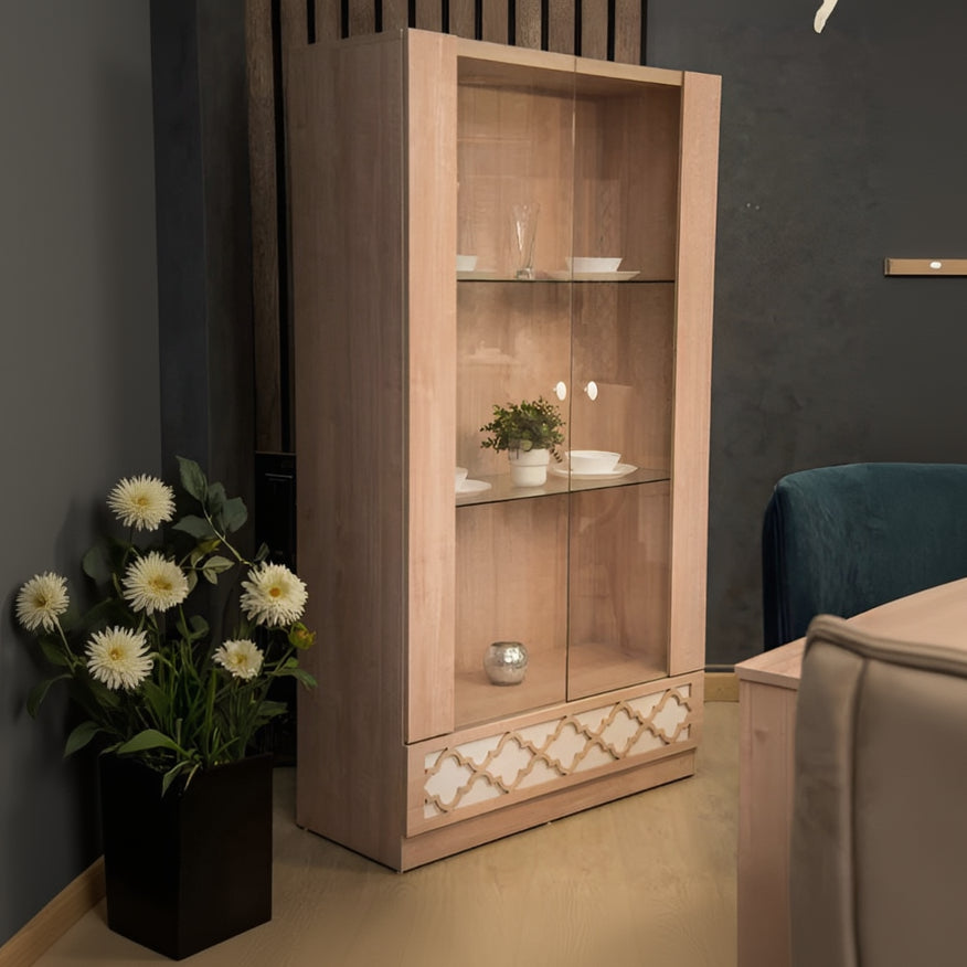 Wooden display cabinet with glass doors in a room setting