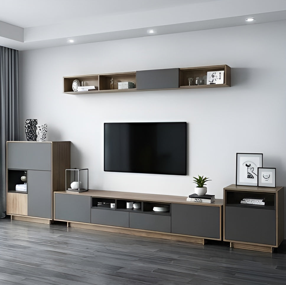 Modern living room with a television and wooden entertainment unit.