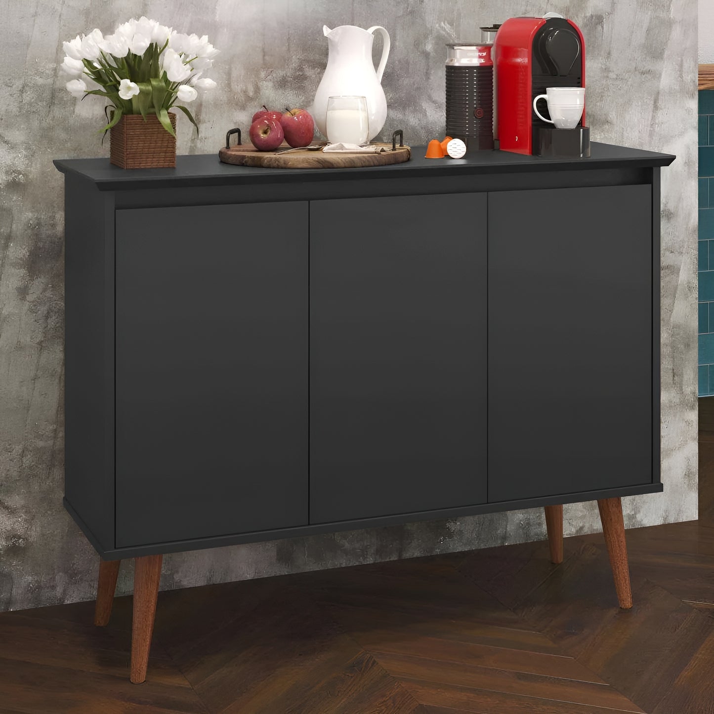 Black sideboard with wooden legs against a gray wall