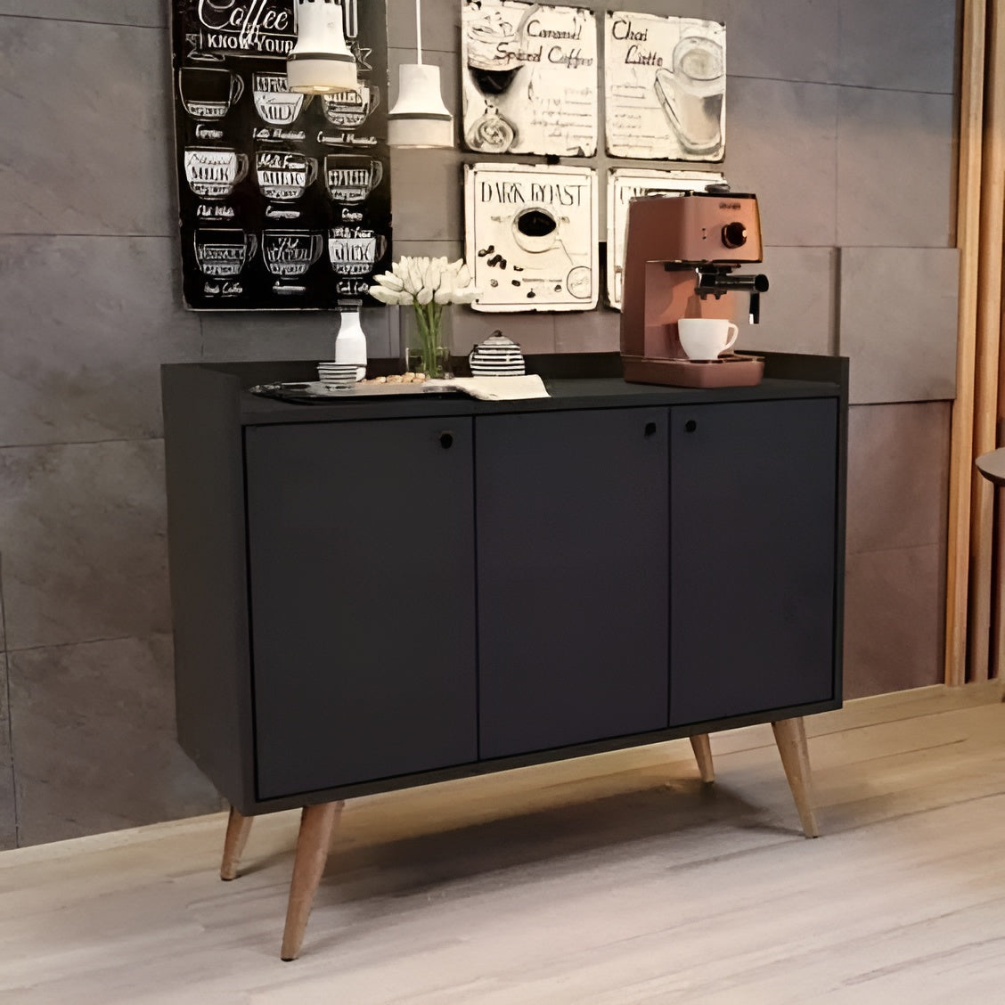 Black cabinet with a coffee machine on a wooden floor against a gray wall.