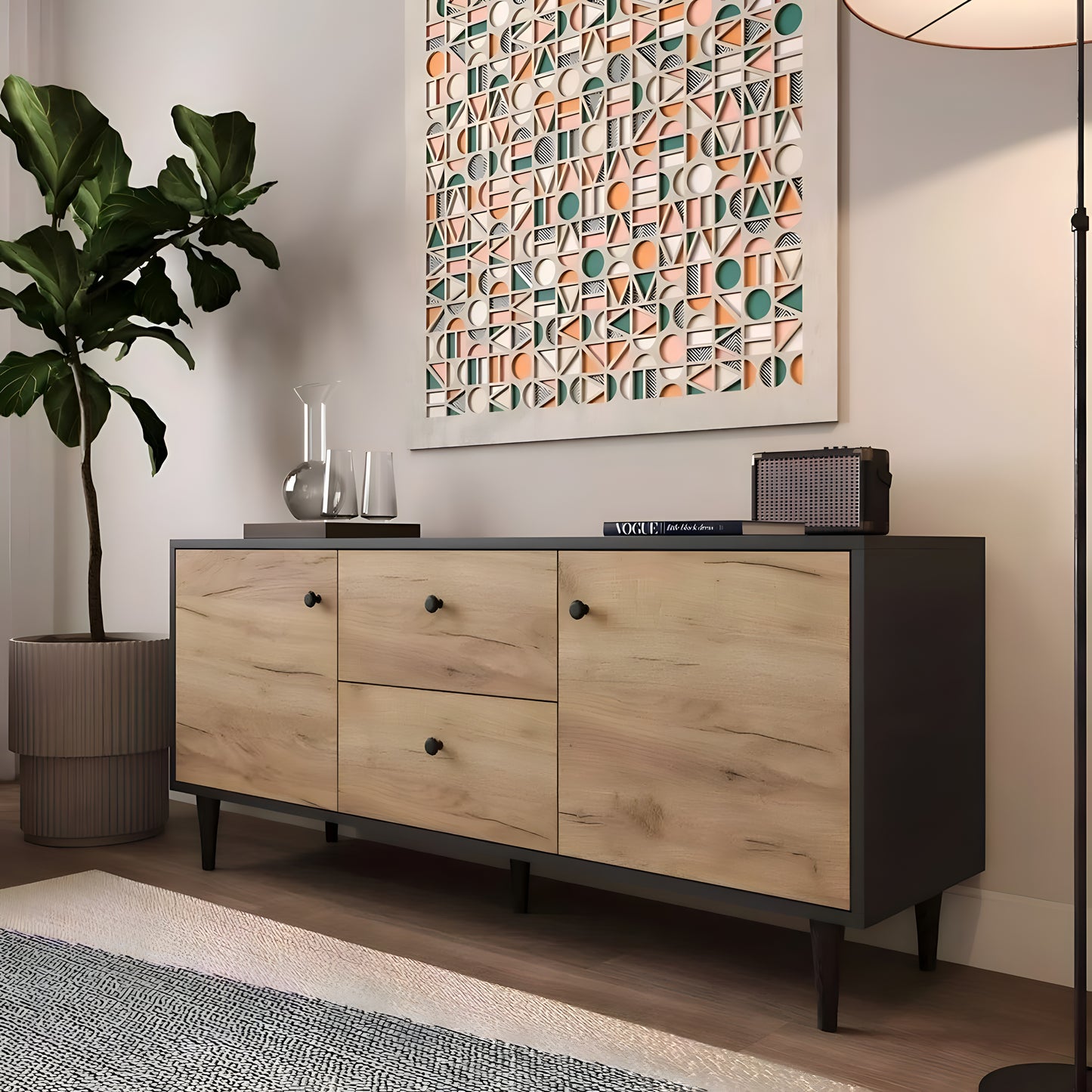 Wooden sideboard with black accents in a room with a geometric wall art piece.