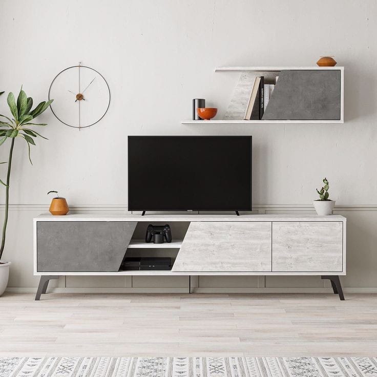 Modern TV stand with a television in a minimalistic living room.