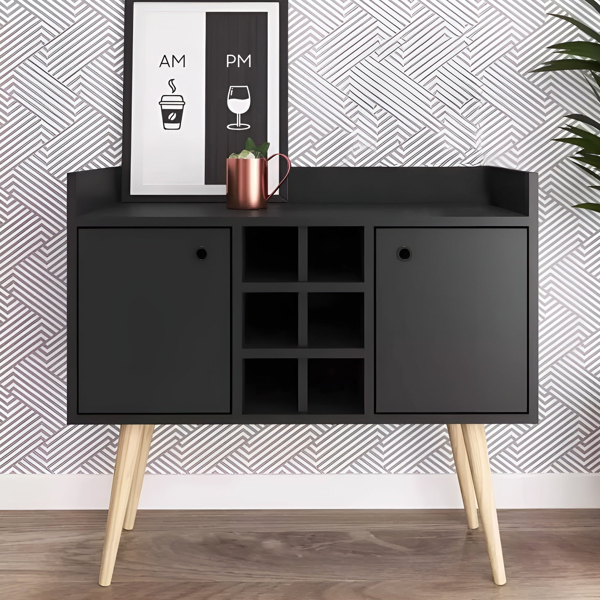 Black cabinet with wooden legs against a patterned wall