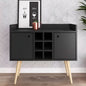 Black cabinet with wooden legs against a patterned wall