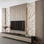 Modern living room setup with a television mounted on a wall panel with marble and wood finishes.