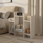 White nightstand with clock in a bedroom setting
