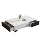 White coffee table with black drawers on a white background