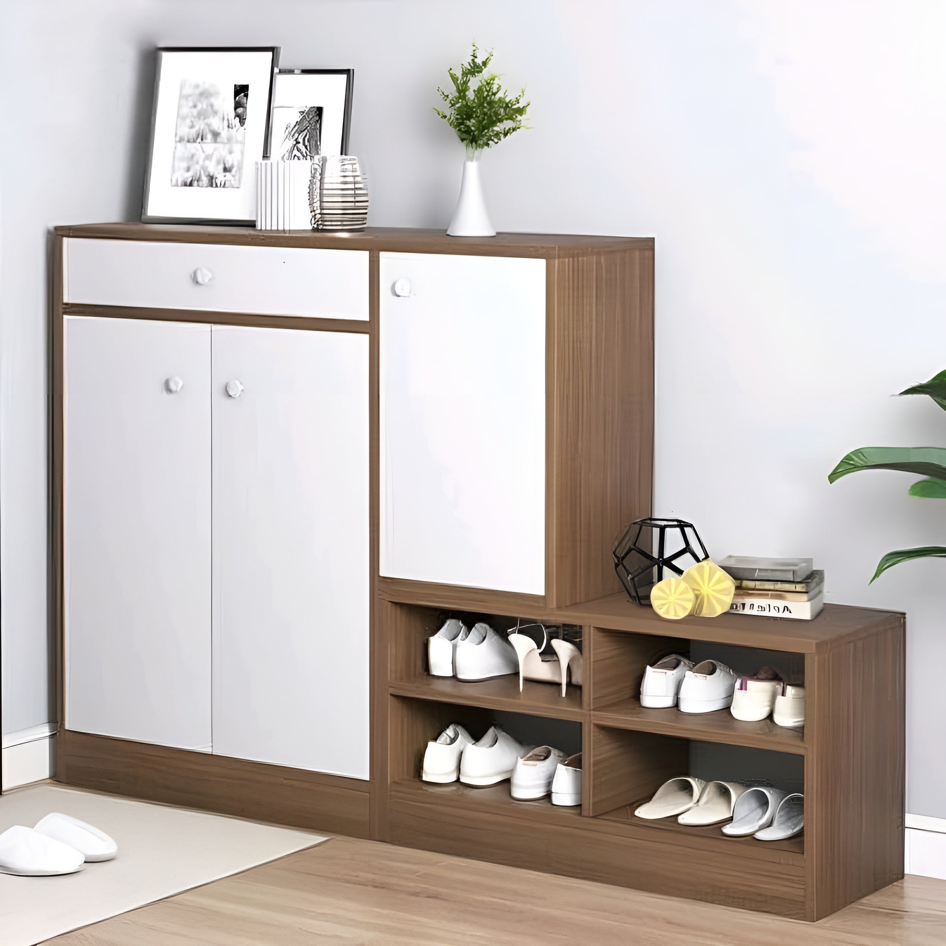 Wooden shoe cabinet with white doors and shelves filled with shoes on a light wooden floor.