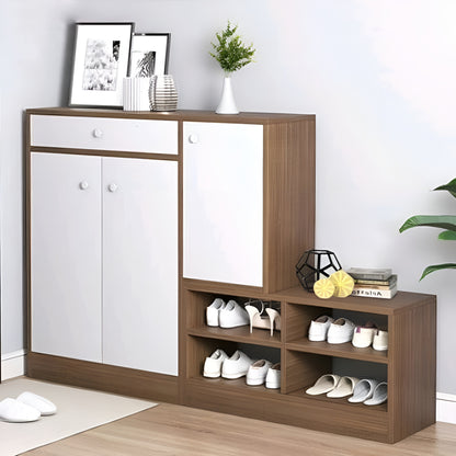 Wooden shoe cabinet with white doors and shelves filled with shoes on a light wooden floor.