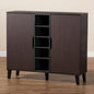 Wooden cabinet with open door on a wooden floor