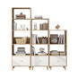 Wooden bookshelf with white drawers and various items on a white background