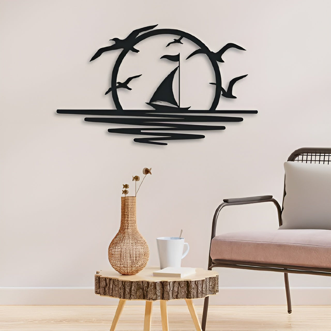 Decorative wall art with sailboat and birds on a plain wall, with a chair and table in the foreground.