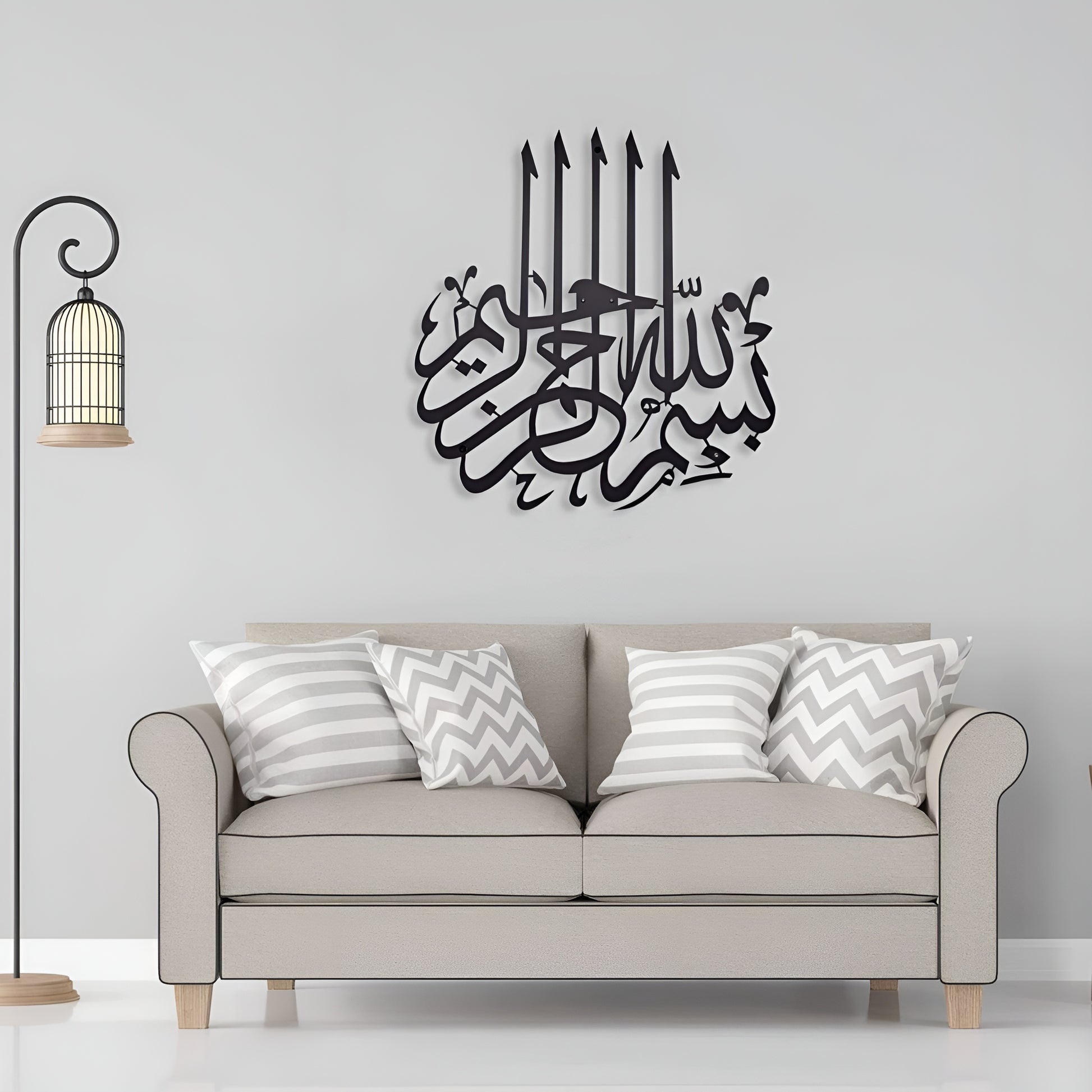 Decorative wall art with Arabic calligraphy on a gray wall above a sofa.
