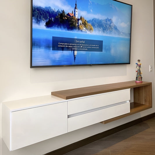 Modern TV stand with a flat-screen TV displaying a scenic image on a wall.