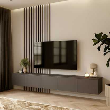 Modern living room with a television mounted on a wall with decorative slats.