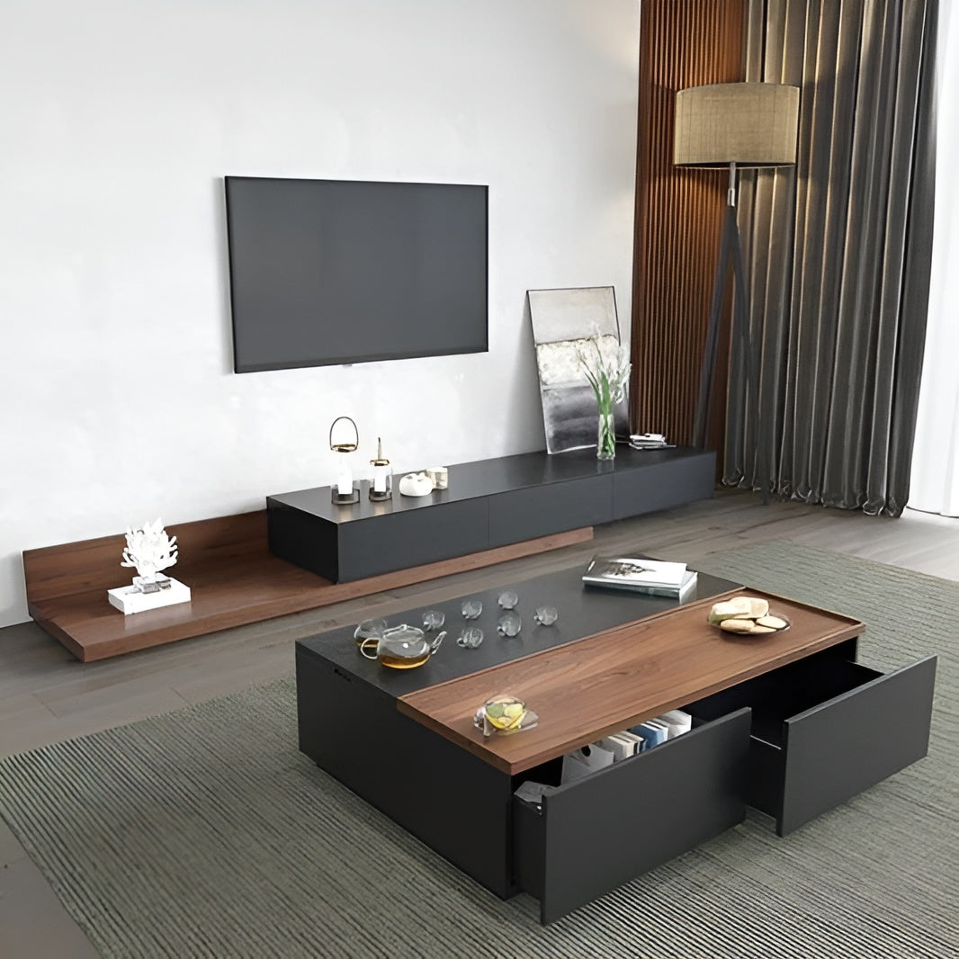 Modern living room with a television, coffee table, and decorative items.
