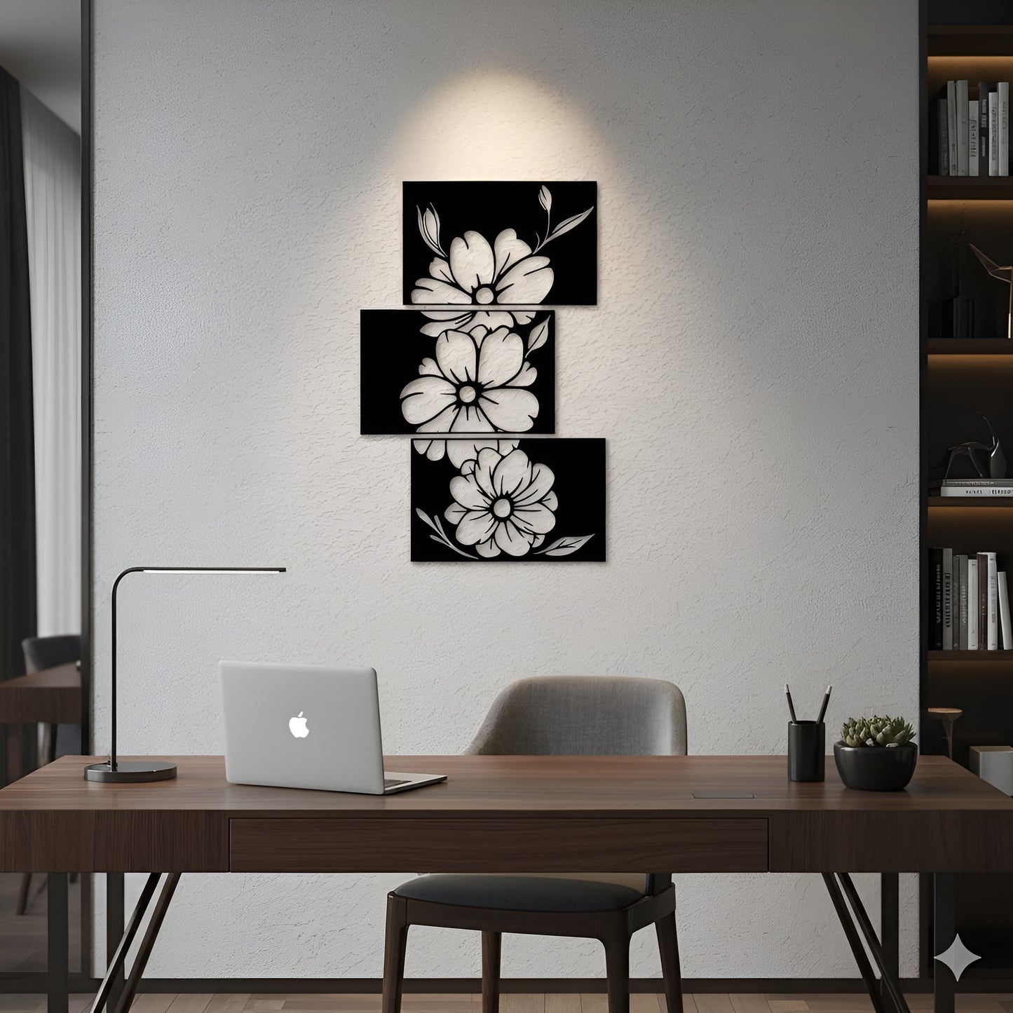 Modern office space with a desk, laptop, and decorative wall art.