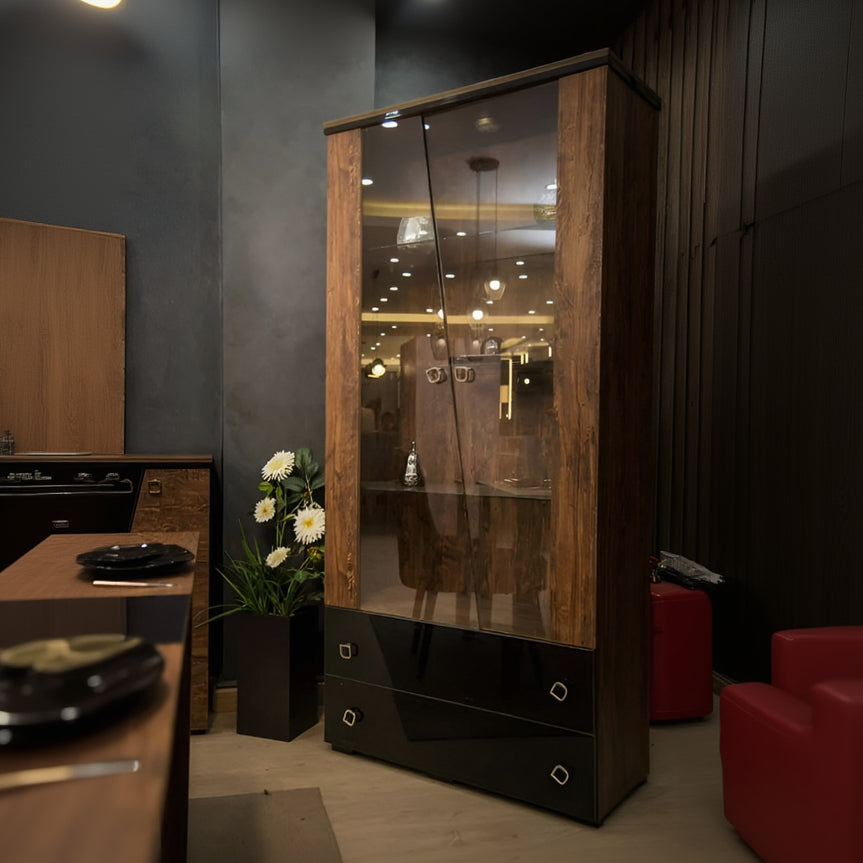 Wooden cabinet with glass doors and black base in a room setting