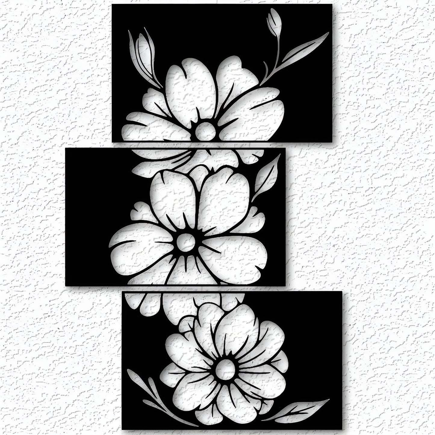 Set of three black and white floral designs on a textured white background