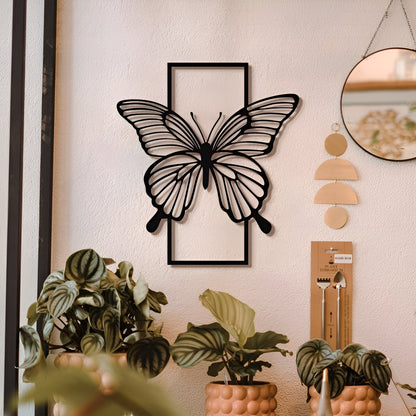 Butterfly wall art on a wall with plants and decor items.
