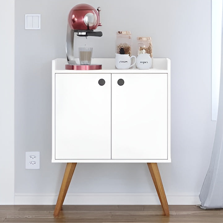 White cabinet with wooden legs holding a coffee maker and jars against a light gray wall.