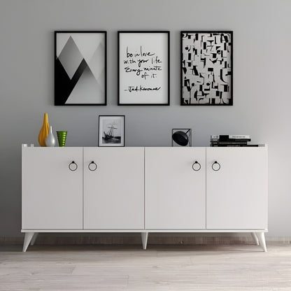 White sideboard with decorative items and framed art on a gray wall.
