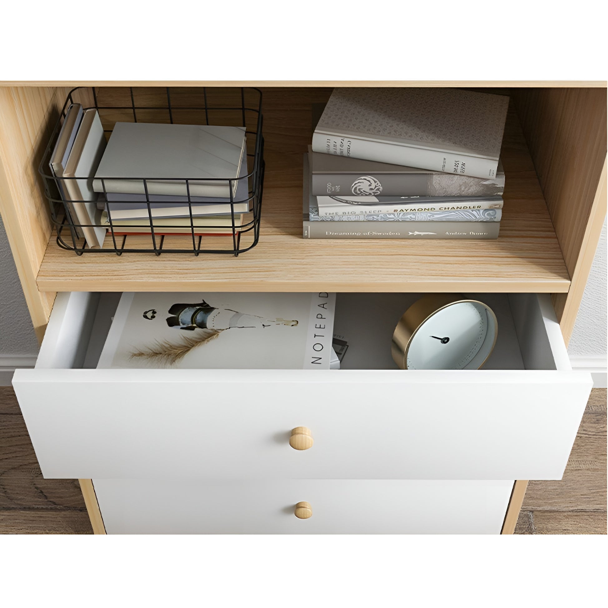 Wooden shelf with books, a clock, and a basket, with a white drawer open underneath.