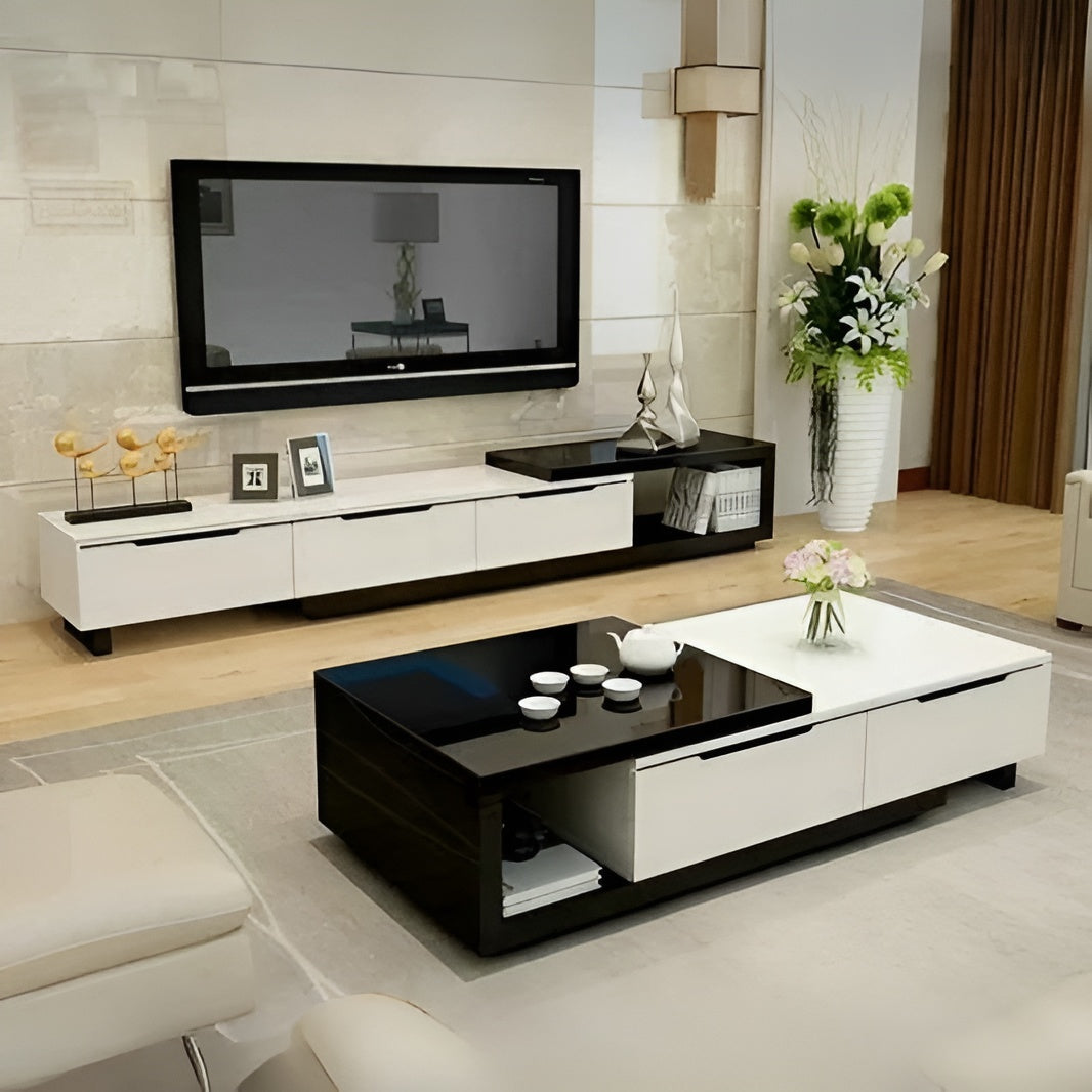 Modern living room with a black and white entertainment console, TV, and coffee table.