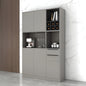 Gray kitchen cabinet with appliances and items against a marble wall.