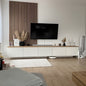 Modern living room with a television mounted on a wall panel