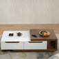 Modern coffee table with white top and wooden side, featuring a teapot and remote control.