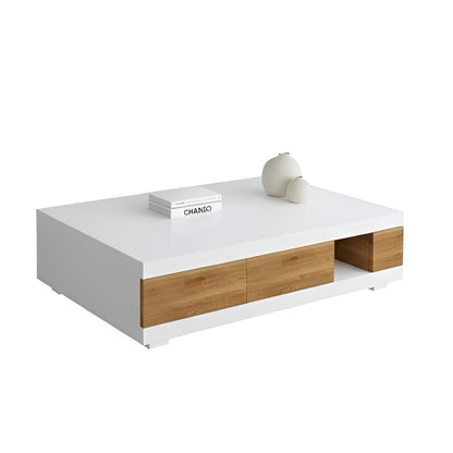 Modern coffee table with white top and wooden drawers on a white background