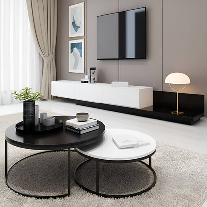 Modern living room with black and white furniture, including a TV and coffee table.