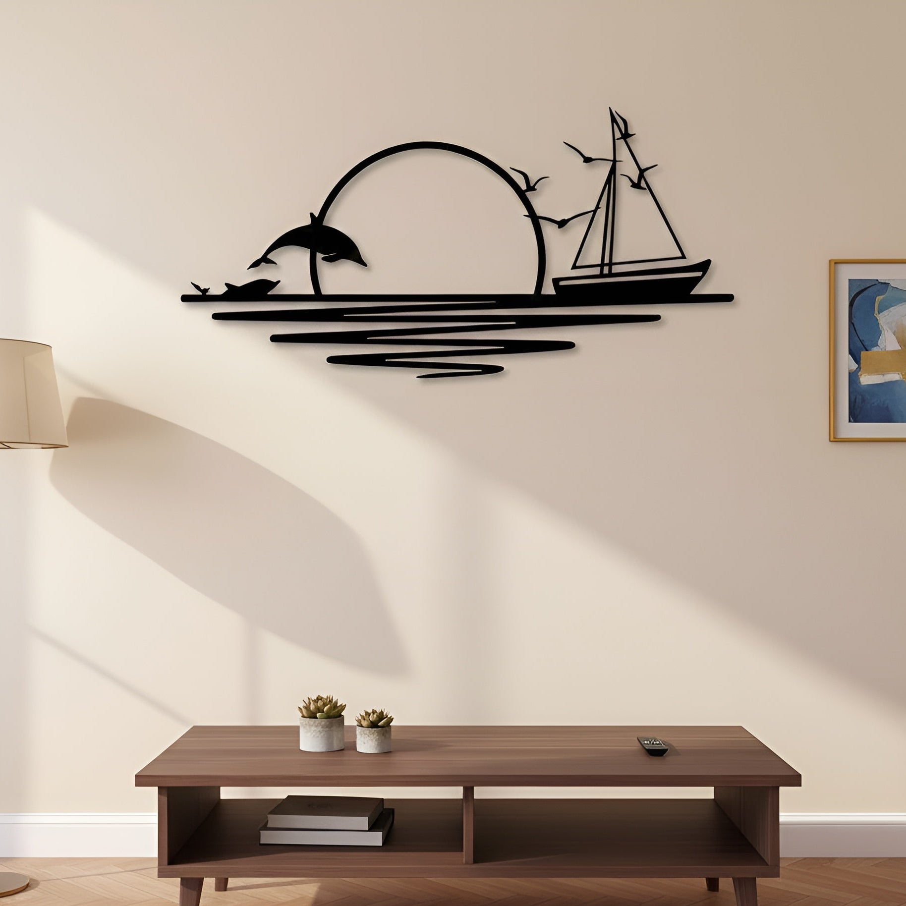 Decorative wall art with a ship and dolphin design on a wall above a wooden coffee table.