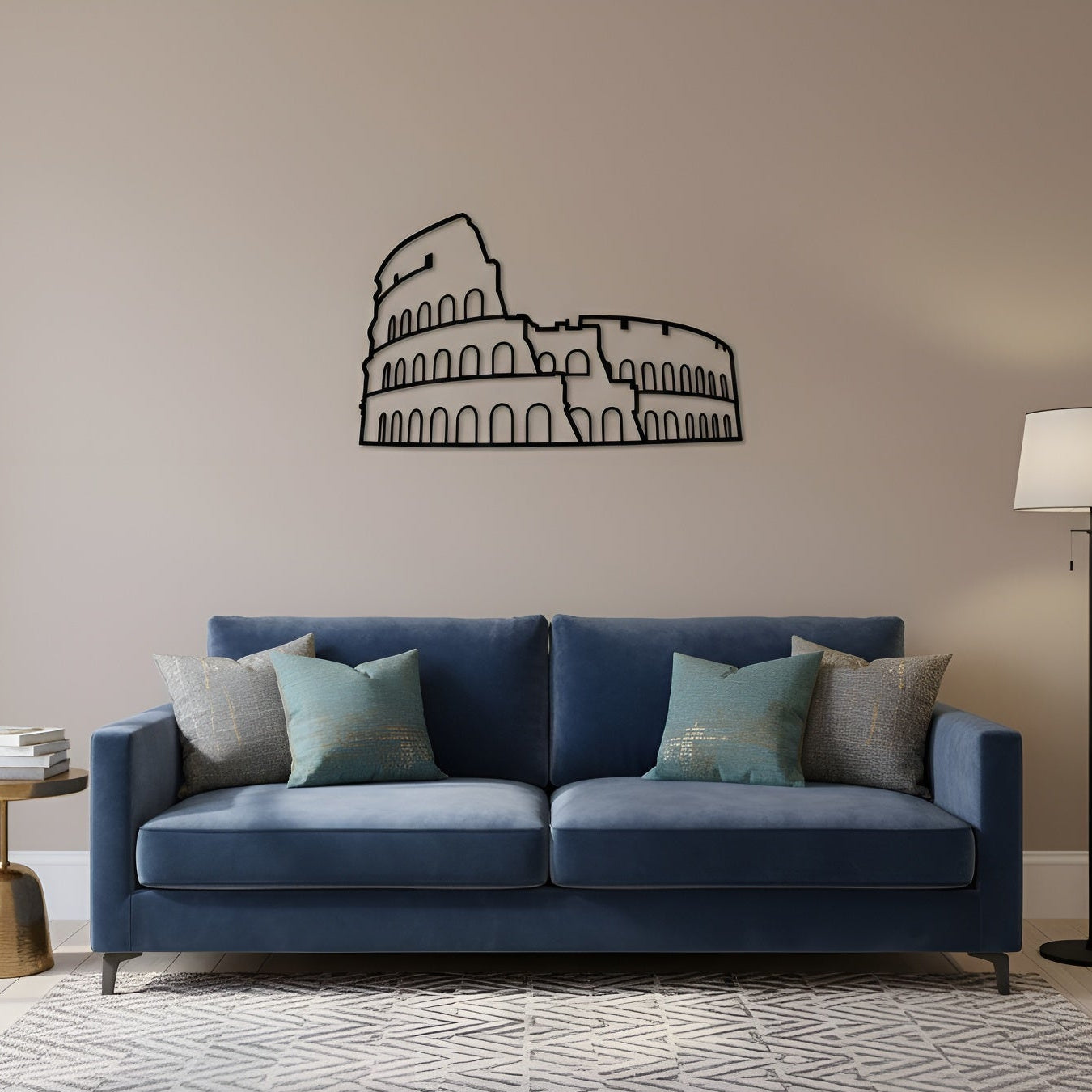 Blue sofa with decorative pillows in a living room setting with a Colosseum wall decal.