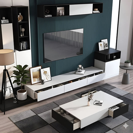 Modern living room with white entertainment console, TV, and decor items.