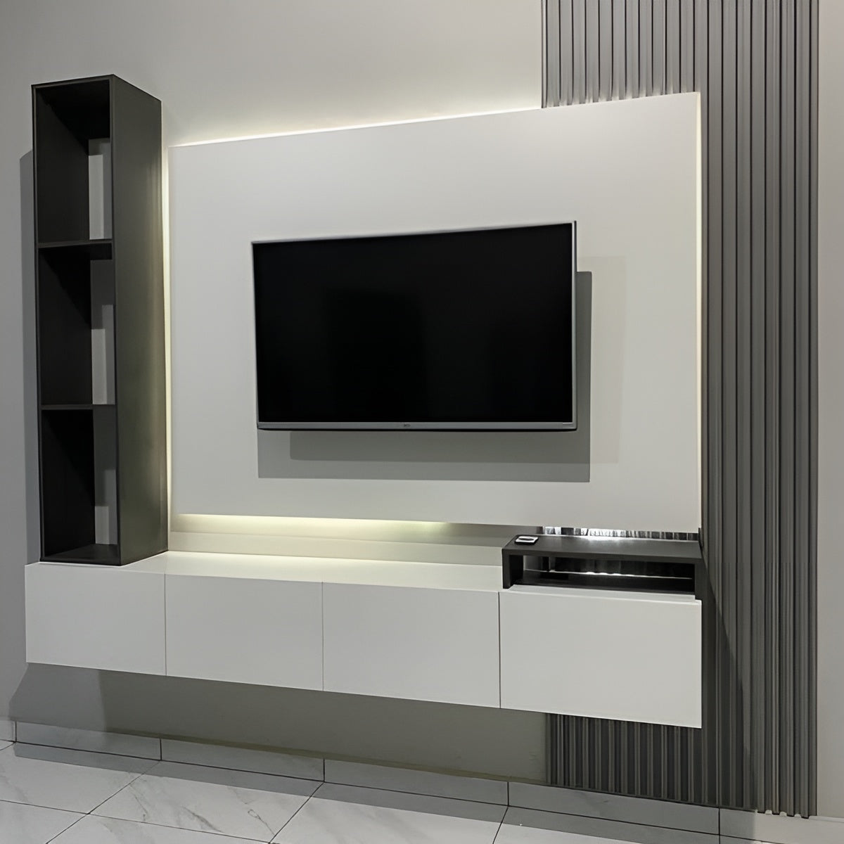 Modern TV unit with a television mounted on a wall in a room.