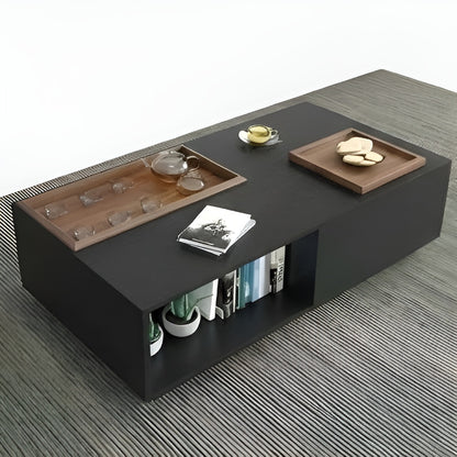 Modern coffee table with wooden trays and decorative items on a gray floor.
