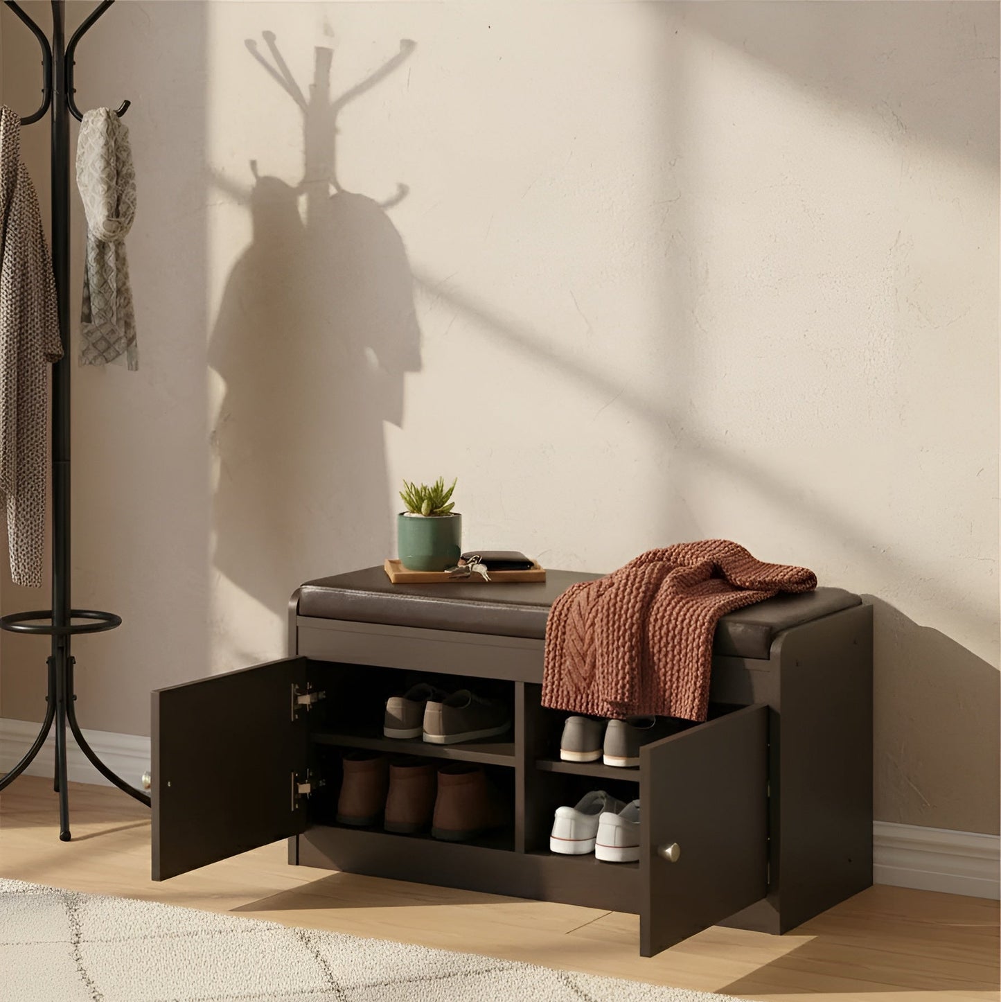 Storage bench with open doors in a room with a coat rack and rug.