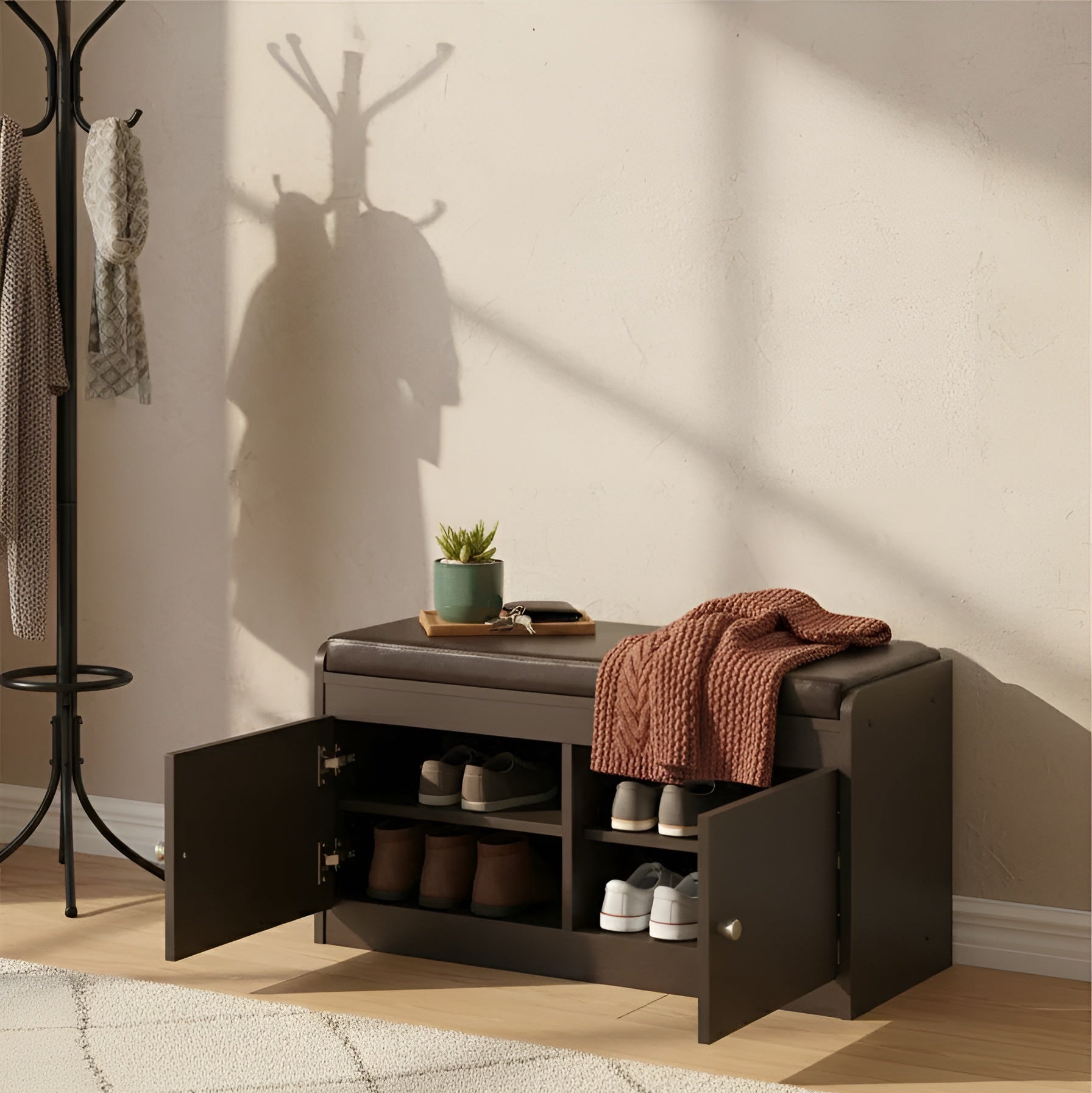 Storage bench with open doors in a room with a coat rack and rug.