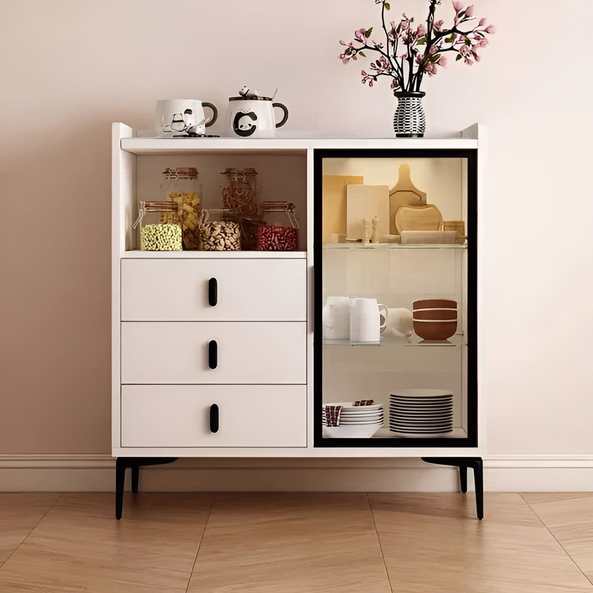White cabinet with glass door displaying items against a beige wall.
