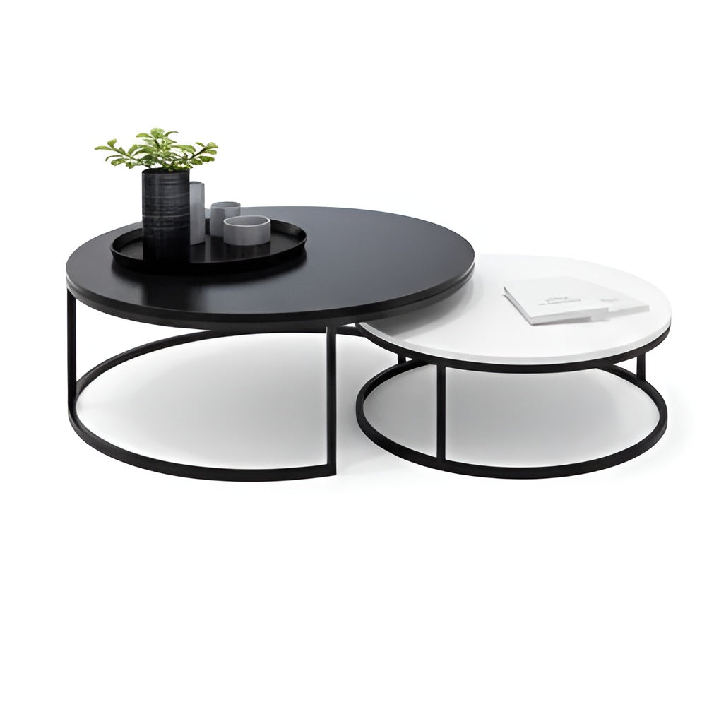 Black and white round coffee table with decorative items on a white background