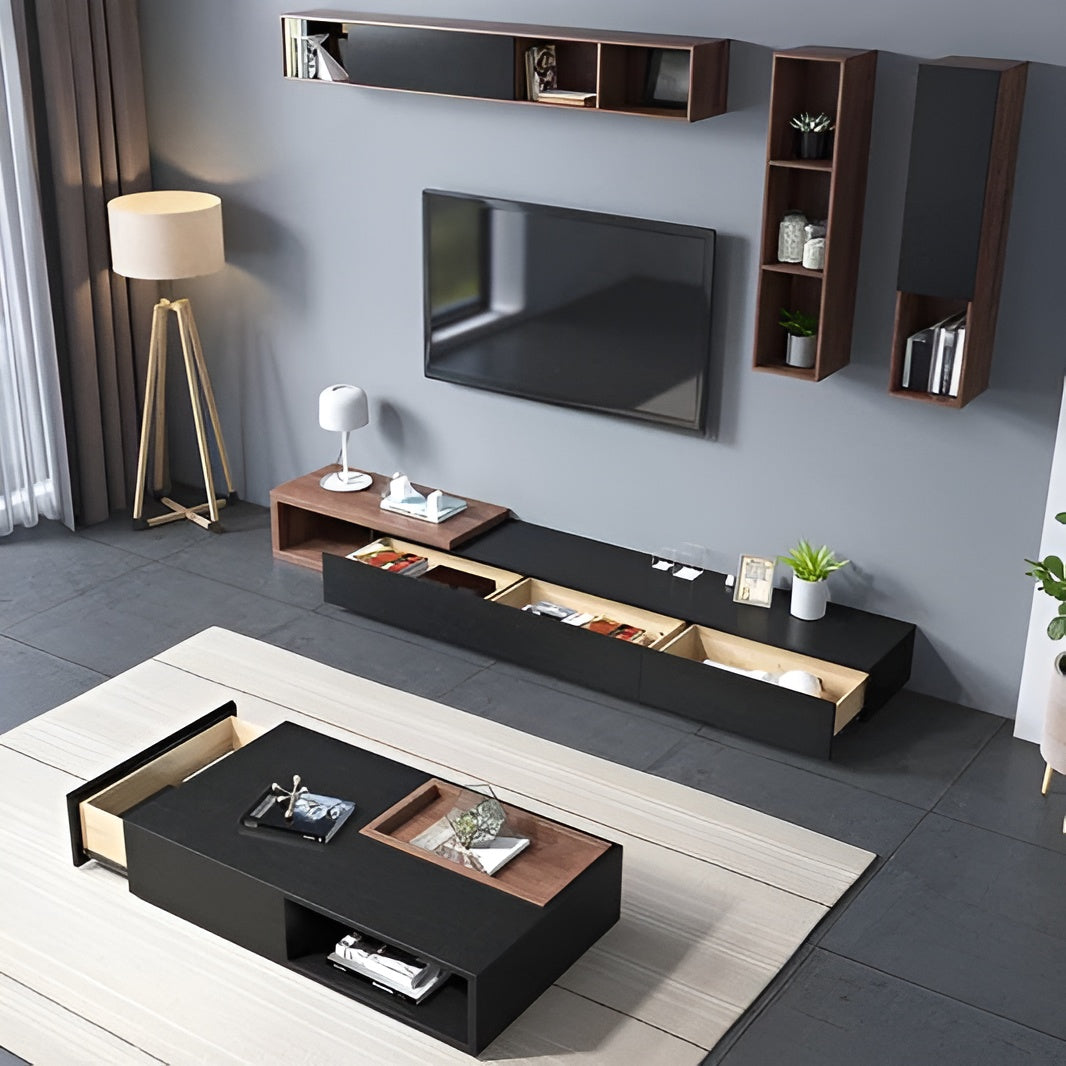 Modern living room with a black entertainment console, TV, and decor items.