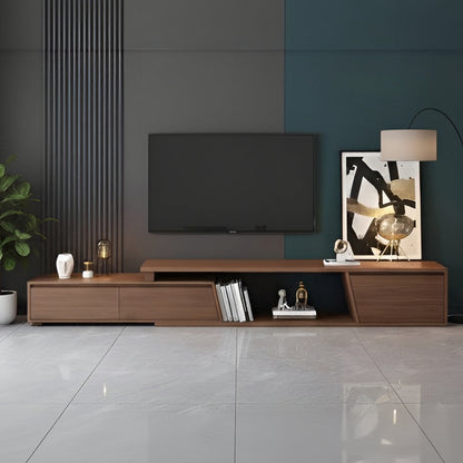 Modern living room with a wooden TV stand, television, and decorative items.