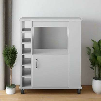White entertainment console with TV stand and cabinet in a room with plants.