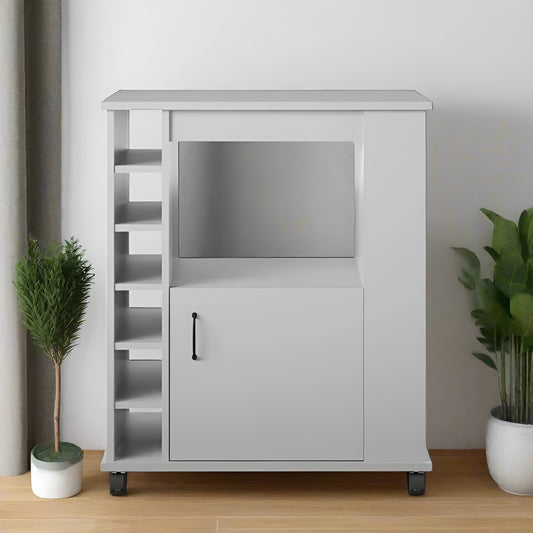 White entertainment console with TV stand and cabinet in a room with plants.