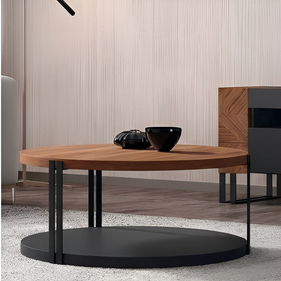 Round wooden coffee table with black metal legs in a modern living room setting.